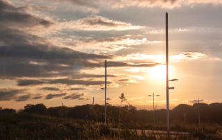 Soluxio hybrid grid-connected lighting along Zilverbaan in Veldhoven at sunset.