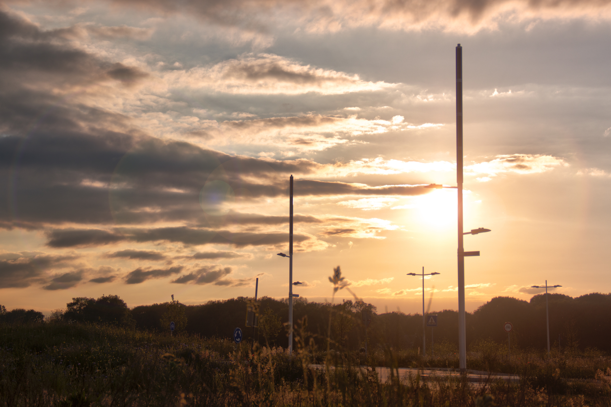 Soluxio hybrid grid-connected lighting along Zilverbaan in Veldhoven at sunset.